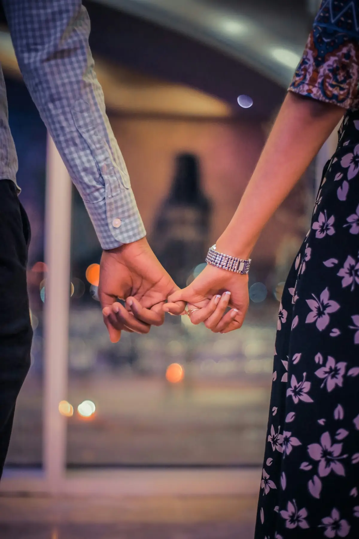 Married couple holding hands