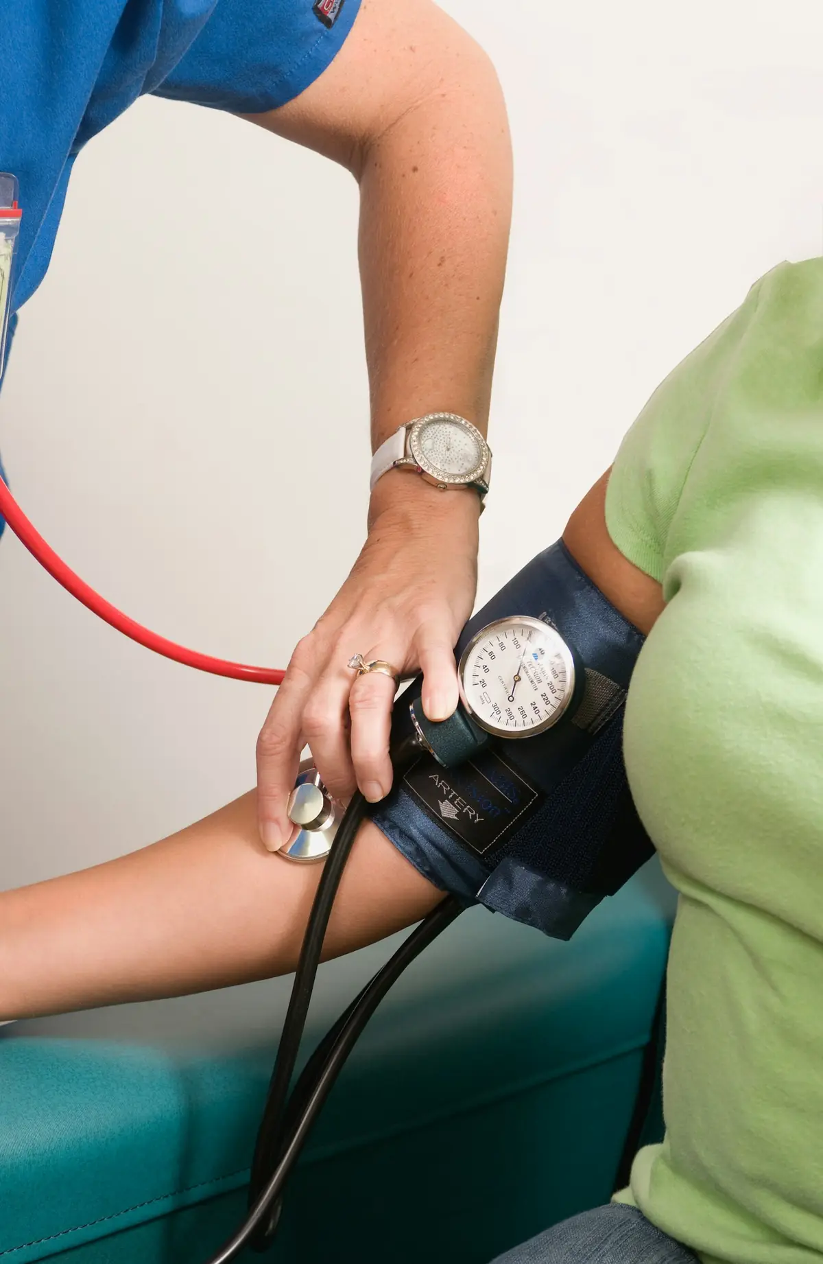 Doctor checking a patient's blood pressure