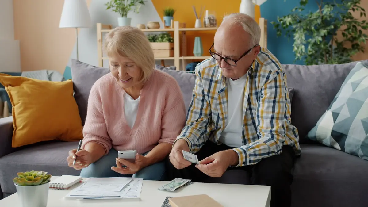 Retired couple relaxing at home